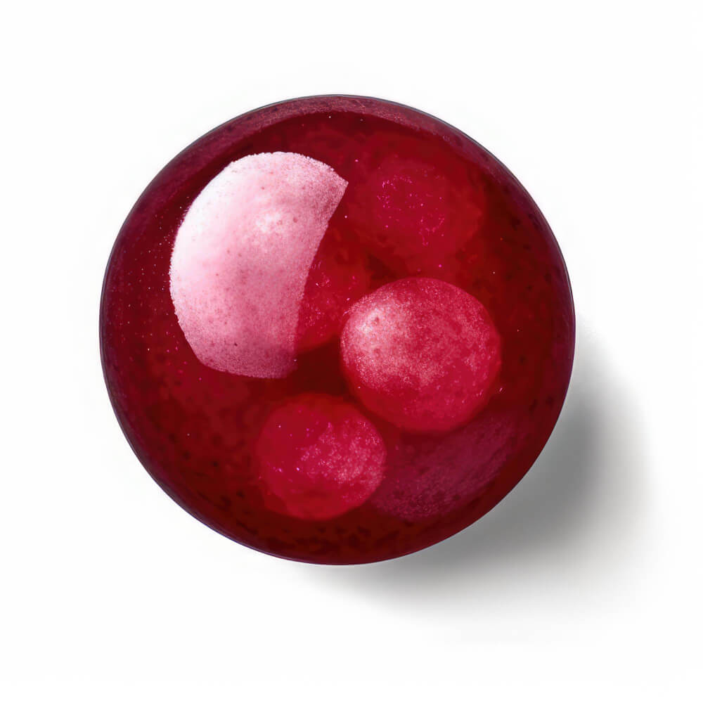 A ruby ball on a plain surface